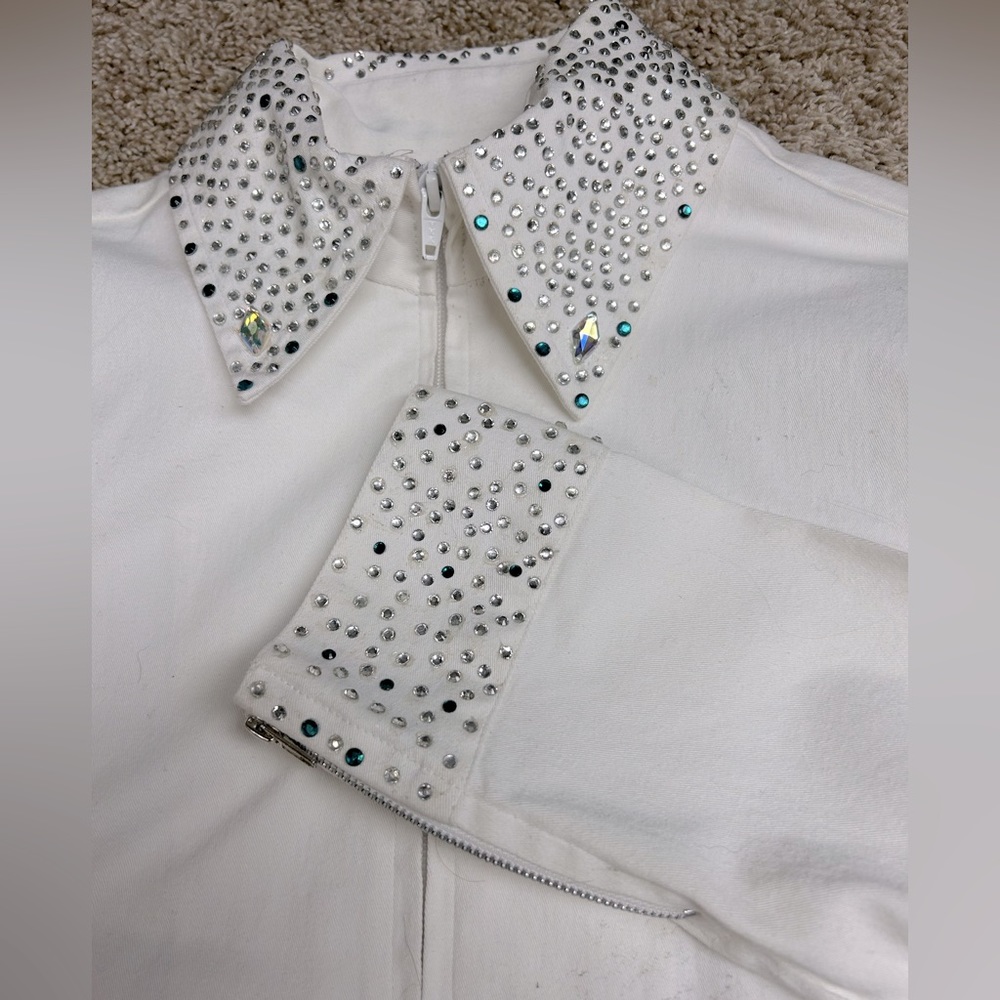White Zip up show shirt with silver and blue rhinestones in size medium.